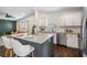Modern open concept featuring a dining area and sleek kitchen with stainless steel appliances at 4205 N Suwanee Ave, Tampa, FL 33603