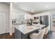 Bright, modern kitchen featuring white cabinetry, stainless steel appliances and a center island with seating at 4205 N Suwanee Ave, Tampa, FL 33603