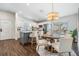 Bright eat-in kitchen features stainless steel appliances, a center island, and access to the outdoor living space at 4205 N Suwanee Ave, Tampa, FL 33603