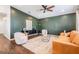 Contemporary living room boasts chic furnishings, a stylish rug, and sleek hardwood flooring at 4205 N Suwanee Ave, Tampa, FL 33603