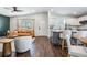 Open-concept space featuring a modern living room seamlessly connected to an elegant white kitchen at 4205 N Suwanee Ave, Tampa, FL 33603