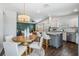 Open floor plan combining kitchen, dining, and living room with a dark green accent wall at 4205 N Suwanee Ave, Tampa, FL 33603