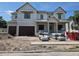 Front exterior of a new two-story home under construction, with a three-car garage at 4208 W Vasconia St, Tampa, FL 33629