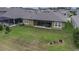 A well-maintained backyard with a covered patio, perfect for outdoor living at 4239 Woodland Retreat Blvd, New Port Richey, FL 34655