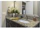 Modern bathroom features granite countertops, dual sinks, and neutral decor at 4239 Woodland Retreat Blvd, New Port Richey, FL 34655