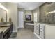 Elegant bathroom featuring a soaking tub, tiled shower, and double vanity with granite countertops at 4239 Woodland Retreat Blvd, New Port Richey, FL 34655
