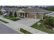 Attractive single-story home featuring a spacious driveway and lush landscaping at 4239 Woodland Retreat Blvd, New Port Richey, FL 34655