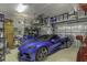 Spacious garage with organized storage, room for multiple vehicles, and bright lighting at 4239 Woodland Retreat Blvd, New Port Richey, FL 34655