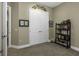 Hallway with double doors and book shelves, offering a versatile space at 4239 Woodland Retreat Blvd, New Port Richey, FL 34655