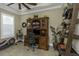 Comfortable home office with desk, built-in shelving, and natural light, ideal for productivity at 4239 Woodland Retreat Blvd, New Port Richey, FL 34655