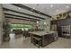 Open-concept kitchen and living area with modern features and high ceilings at 4239 Woodland Retreat Blvd, New Port Richey, FL 34655