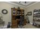 This office features a large wooden desk with shelves, perfect for organizing and displaying personal items at 4239 Woodland Retreat Blvd, New Port Richey, FL 34655