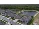 Aerial street view showcasing a well-maintained property and adjacent pond in a desirable neighborhood at 4239 Woodland Retreat Blvd, New Port Richey, FL 34655
