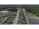 Aerial view of a home located on a street near a pond with other similar neighborhood properties at 4239 Woodland Retreat Blvd, New Port Richey, FL 34655