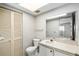 Bathroom with a single sink vanity, toilet, and closet for storage at 4309 Cedar Grove St, Holiday, FL 34691