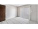 Clean bedroom showcasing neutral walls, tiled floor and sliding glass door at 4309 Cedar Grove St, Holiday, FL 34691