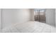 Bright bedroom with white tiled floors and a sliding glass door to the outside at 4309 Cedar Grove St, Holiday, FL 34691