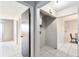 Hallway view featuring a water heater closet and ceramic tile flooring at 4309 Cedar Grove St, Holiday, FL 34691