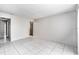Spacious living room with light walls and ceramic tile flooring at 4309 Cedar Grove St, Holiday, FL 34691