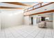 This is a bright, open living space with vaulted ceilings, exposed beams, and views of the kitchen at 4309 Cedar Grove St, Holiday, FL 34691