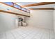 This is a bright, open living space with vaulted ceilings, exposed beams, and views of the kitchen at 4309 Cedar Grove St, Holiday, FL 34691