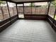 Screened patio with gray brick floor, providing an outdoor living area at 4309 Cedar Grove St, Holiday, FL 34691
