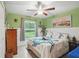 Nautical themed bedroom with turtle accents, a ceiling fan, and a view of the outdoors at 5153 Bayley St, North Port, FL 34288