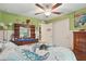 Bright bedroom with coastal decor, including a turtle-themed bedspread and nautical decorations at 5153 Bayley St, North Port, FL 34288
