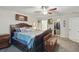 Spacious bedroom featuring a beautiful bed frame, walk-in closet and ceiling fan at 5153 Bayley St, North Port, FL 34288