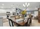 Open kitchen and dining area with views of the living room provides a perfect space for entertaining at 5153 Bayley St, North Port, FL 34288