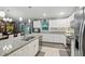 Bright kitchen featuring an island, granite countertops, and stainless-steel appliances at 5153 Bayley St, North Port, FL 34288