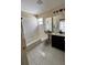 Bathroom featuring a shower-tub combo, vanity and tile floors at 6213 Ashfield Pl, Wesley Chapel, FL 33545