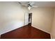 Bedroom with vaulted ceiling and hardwood floors at 6213 Ashfield Pl, Wesley Chapel, FL 33545
