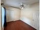 Cozy bedroom featuring hardwood floors and a ceiling fan at 6213 Ashfield Pl, Wesley Chapel, FL 33545