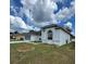 Charming one-story home with a manicured lawn and beautiful architectural details at 6213 Ashfield Pl, Wesley Chapel, FL 33545