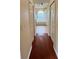 Hallway view of a bright bathroom featuring double closets at 6213 Ashfield Pl, Wesley Chapel, FL 33545