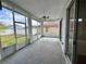 Spacious screened-in lanai perfect for enjoying outdoor living and backyard views at 6213 Ashfield Pl, Wesley Chapel, FL 33545