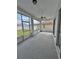 Large screened lanai offers outdoor living space with view of backyard at 6213 Ashfield Pl, Wesley Chapel, FL 33545