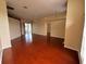 Bright and airy living room with hardwood floors and plenty of natural light at 6213 Ashfield Pl, Wesley Chapel, FL 33545