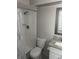 Bathroom featuring a shower with white tile surround, granite vanity, and tile floors at 639 48Th N Ave, St Petersburg, FL 33703