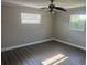 Cozy bedroom featuring neutral paint, luxury vinyl plank flooring, and windows at 639 48Th N Ave, St Petersburg, FL 33703
