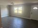 Bright living room with updated luxury vinyl plank flooring, new window, and fresh paint at 639 48Th N Ave, St Petersburg, FL 33703