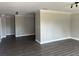Spacious living room featuring gray walls, white crown molding, and luxury vinyl plank flooring at 639 48Th N Ave, St Petersburg, FL 33703