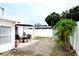 Spacious backyard featuring a patio with an outdoor table and chair set at 6508 Lenore Dr, Tampa, FL 33634