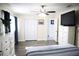 Cozy bedroom featuring a ceiling fan, hardwood floors and closet at 6508 Lenore Dr, Tampa, FL 33634