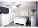 Bright bedroom featuring hardwood floors, a comfortable bed, and a white dresser at 6508 Lenore Dr, Tampa, FL 33634