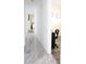 Bright hallway showcasing marble floors that lead to the bedroom and office space at 6508 Lenore Dr, Tampa, FL 33634