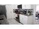 Modern kitchen with granite countertops, stainless steel appliances, and white cabinetry at 6508 Lenore Dr, Tampa, FL 33634