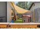 Backyard area with a playground, a playhouse, and a covered area for  at 6521 69Th N Ave, Pinellas Park, FL 33781