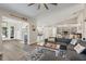 Open-concept living space with a modern kitchen, dining area, and comfortable seating at 6521 69Th N Ave, Pinellas Park, FL 33781
